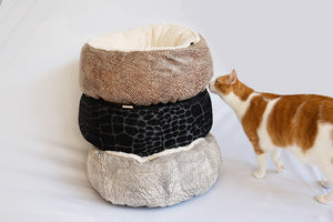 P.L.A.Y. Donut Cuddler Bed Group tower stack with ginger cat sniffing them