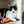 Load image into Gallery viewer, P.L.A.Y. Feline Frenzy Halloween Menacing Mice Toy Set - orange mouse sittng next to black and white cat in a cubby
