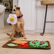 Load image into Gallery viewer, P.L.A.Y. Savory Sunrise Snuffle Mat - scruffy dog holding the egg in its mouth looking over to human with mat on the floor