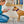 Load image into Gallery viewer, P.L.A.Y.&#39;s Forest Friends Collection - Baxter the Bunny Toy in dog mom&#39;s hands presenting to pup with smile on her face and dog&#39;s tongue out ready to play

