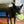Load image into Gallery viewer, P.L.A.Y. Barktender Collection - Pup-artia Toy hanging out of beautiful black dog&#39;s mouth walking out of kitchen
