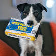 Load image into Gallery viewer, P.L.A.Y. 90s Classics Collection - Woofbuster Video Toy in black and white dog's mouth staring into the camera