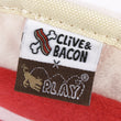 Load image into Gallery viewer, Clive & Bacon x P.L.A.Y. Crispy Bacon Toy sewn-in label close-up