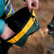 Load image into Gallery viewer, P.L.A.Y.'s Landscape Series Travel Bowl - Moss Travel Bowl being opened up by human with dog looking up at it