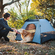 Load image into Gallery viewer, Scout & About Landscape Series Outdoor Dog Tent by P.L.A.Y. - human and dog enjoying Eclipse tent in middle of the woods