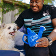 Load image into Gallery viewer, Blooming Buddies Collection by P.L.A.Y. Waggin' Watering Can Toy being presented to dog by dog dad