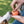 Load image into Gallery viewer, ZoomieRex IncrediBall by P.L.A.Y. - orange ball getting stuffed with treats by human with dog nosing it
