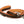 Load image into Gallery viewer, Napoli Leashes by P.L.A.Y. - orange and brown leash rolled up
