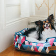Load image into Gallery viewer, Mosaic Lounge Bed by P.L.A.Y. in Soda Pop with dog smiling up in it