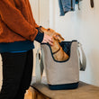 Load image into Gallery viewer, LeftPine x P.L.A.Y. Navy Striped Dog Carrier with dog in carrier on bench looking up at human