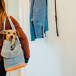 Load image into Gallery viewer, LeftPine x P.L.A.Y. Deluxe Dog Carrier with dog in Gray version being carried by dog mom