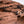 Load image into Gallery viewer, P.L.A.Y. Big Five of Africa Collection - Lion Toy perched up the side of the red rocks overlooking the land
