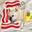 Load image into Gallery viewer, Clive &amp; Bacon x P.L.A.Y. Toy Collab - pictured with Nova the Frenchie on a white bed with bacon toys and beer toy surrounding it
