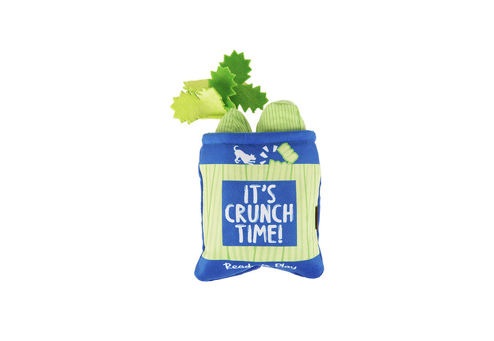 P.L.A.Y. Picked Fresh Crunch Bunch Toy: two celery stalks inside a bag with the text 'It's Crunch Time!' on a white background