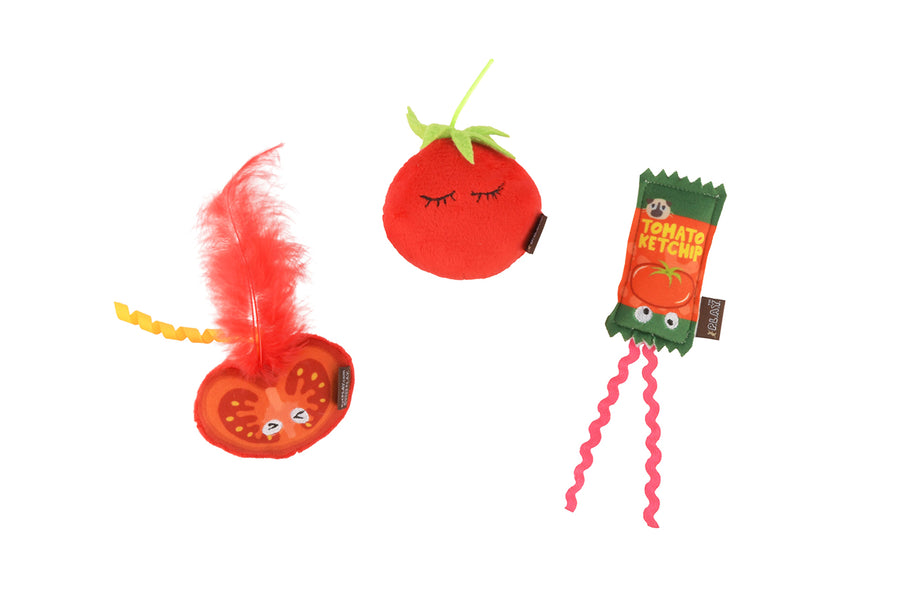 P.L.A.Y. Feline Frenzy Toma-toe Beans toy set with three cat toys shaped like tomatoes - a whole tomato looking sleepy, a tomato slice with a feather coming out of the top and a ketchup packet design on a white background.