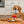 Load image into Gallery viewer, IHOP x P.L.A.Y. Breakfast Sampler Collab - all four toys shown on kitchen floor with brown dog holding coffee mug handle in its mouth
