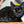Load image into Gallery viewer, P.L.A.Y. Feline Frenzy Halloween Boo Crew Toy Set - black cat posing with ghost toy on a pumpkin Chill Pad
