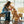 Load image into Gallery viewer, P.L.A.Y. Puppy Love Collection - Rover&#39;s Roses Toy between a dog mom and Golden Doodle sharing a kiss in living room

