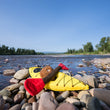 Load image into Gallery viewer, P.L.A.Y. Camp Corbin K9 Kayak Toy on rocks with lake in the background
