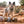 Load image into Gallery viewer, P.L.A.Y.&#39;s Big Five of Africa Toy Set - toys at the feet of a mutil-colored dog on the red rocks of Utah
