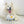 Load image into Gallery viewer, P.L.A.Y. Splish Splash Collection - Rub-a-dub-Tub Toy - white fluffy dog smiling in front of tub with toy in between paws
