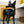 Load image into Gallery viewer, P.L.A.Y. Splish Splash Collection - Bark n&#39; Bristles Toy in mouth of beautiful black dog standing in bathroom looking up
