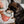 Load image into Gallery viewer, P.L.A.Y. Hollywoof Cinema Poppin&#39; Pupcorn Toy - little black dog biting a kernal out of the box while dog mom is holding on
