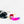 Load image into Gallery viewer, A black and white cat lying on its side playing with P.L.A.Y. Feline Frenzy Fig N’ Whiskers Toy Set on a white background

