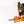 Load image into Gallery viewer, P.L.A.Y. Alien Buddies Astro Explorer Toy - big black and brown dog posing with toy between it&#39;s front paws while smiling into camera
