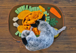 P.L.A.Y. Thanksgiving Snuffle Mat - little pup seeking sniffing out treats in turkey