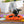 Load image into Gallery viewer, P.L.A.Y. Halloween Snuffle Mat - dog nosing the pumpkin in the center of the mat to find treats on porch
