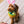 Load image into Gallery viewer, P.L.A.Y. Hippity Hoppity Collection - Eggs-cellent Basket Toy being held by rope handing in dog&#39;s mouth wearing bunny ears

