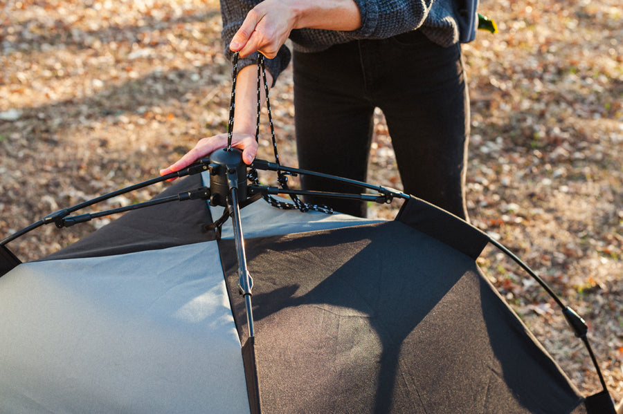 Scout & About Landscape Series Outdoor Dog Tent by P.L.A.Y. -  human setting up tent