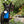Load image into Gallery viewer, Blooming Buddies Collection by P.L.A.Y. Waggin&#39; Watering Can Toy being used to water plants by beautiful black dog
