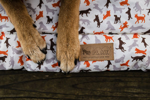 Scout & About Outdoor Chill Pad in Vanilla with dog's paws only on mat