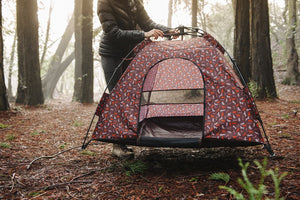 Scout & About Outdoor Dog Tent by P.L.A.Y. - human placing tent on the ground