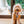 Load image into Gallery viewer, P.L.A.Y. Canine Commute San Pup-cisco Cable Car - toy hanging from golden doodles mouth from one of the rope tracks in front of sliding door
