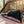 Load image into Gallery viewer, Scout &amp; About Outdoor Chill Pad in Mocha with dog sleeping on it outside on a deck
