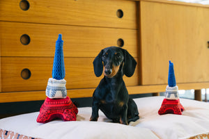 P.L.A.Y. Totally Touristy Eiffel Tower Dog Toy - both sizes of toys pictured with small wiener dog